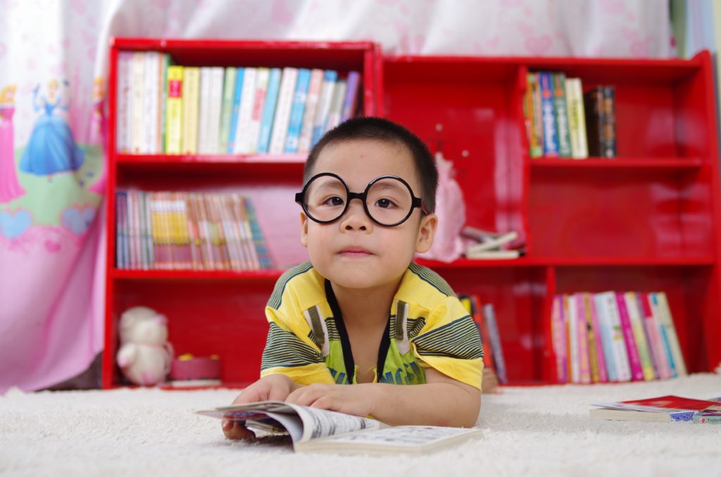 boy glasses reading